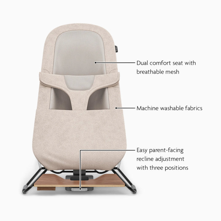 UPPAbaby beige bouncer feature callout with dual seat and breathable mesh and machine washable fabrics with easy recline adjustments.