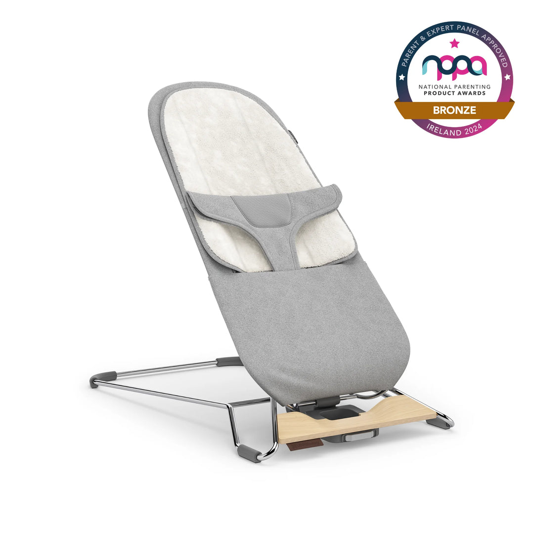 UPPAbaby baby bouncer in light grey colour with bronze NPPA logo on white background.