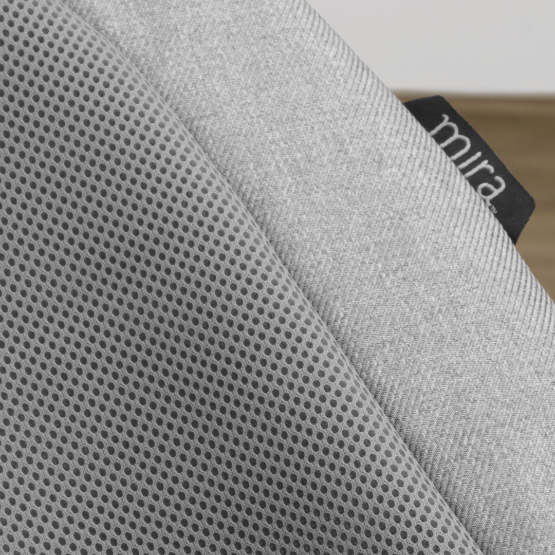 A close up shot of the Mira bouncer fabrics, showing the breathable mesh and soft fabric