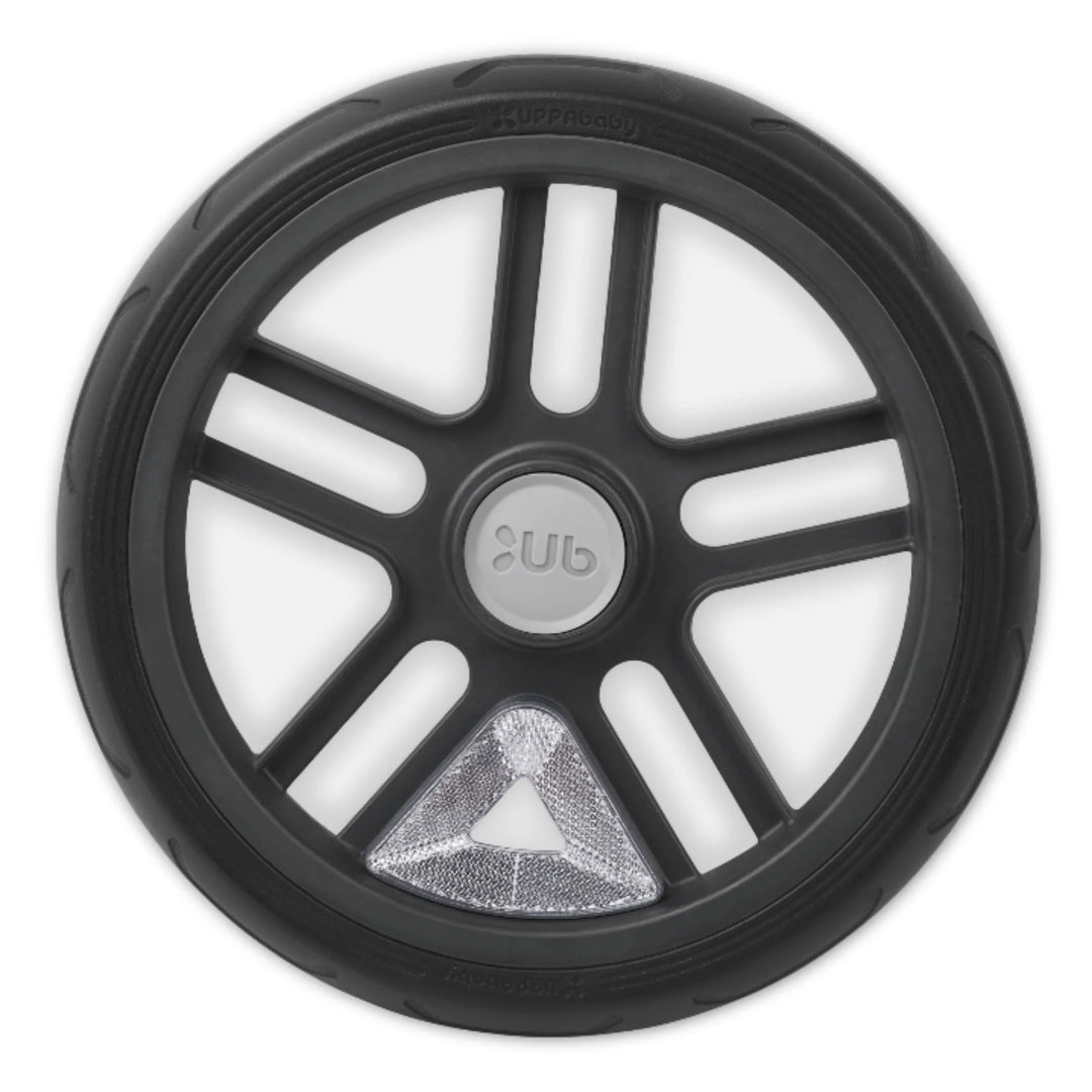“UPPAbaby snap-on wheel reflector on rear stroller wheel for added visibility and safety (close-up).