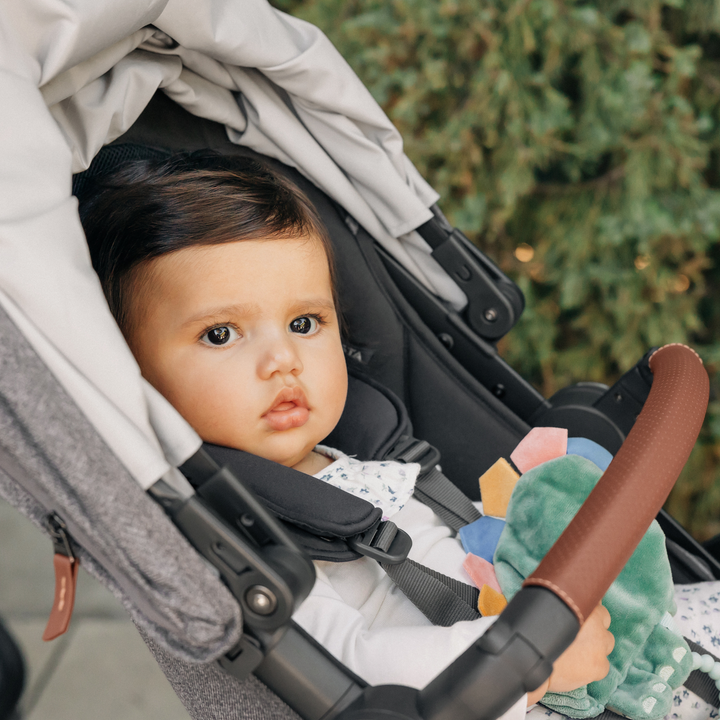 This image is a close up of a cute toddler in the main seat unit of the Vista V3 with the canopy pushed back.