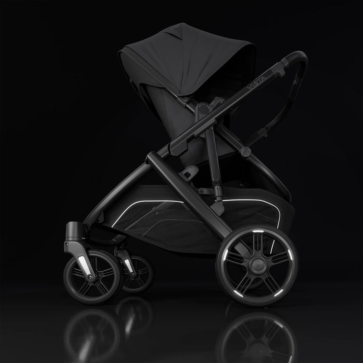 UPPAbaby Vista V3 Jake stroller with reflective wheels and sleek black design, showcasing premium craftsmanship, safety features, and modern aesthetics on a dark studio background.