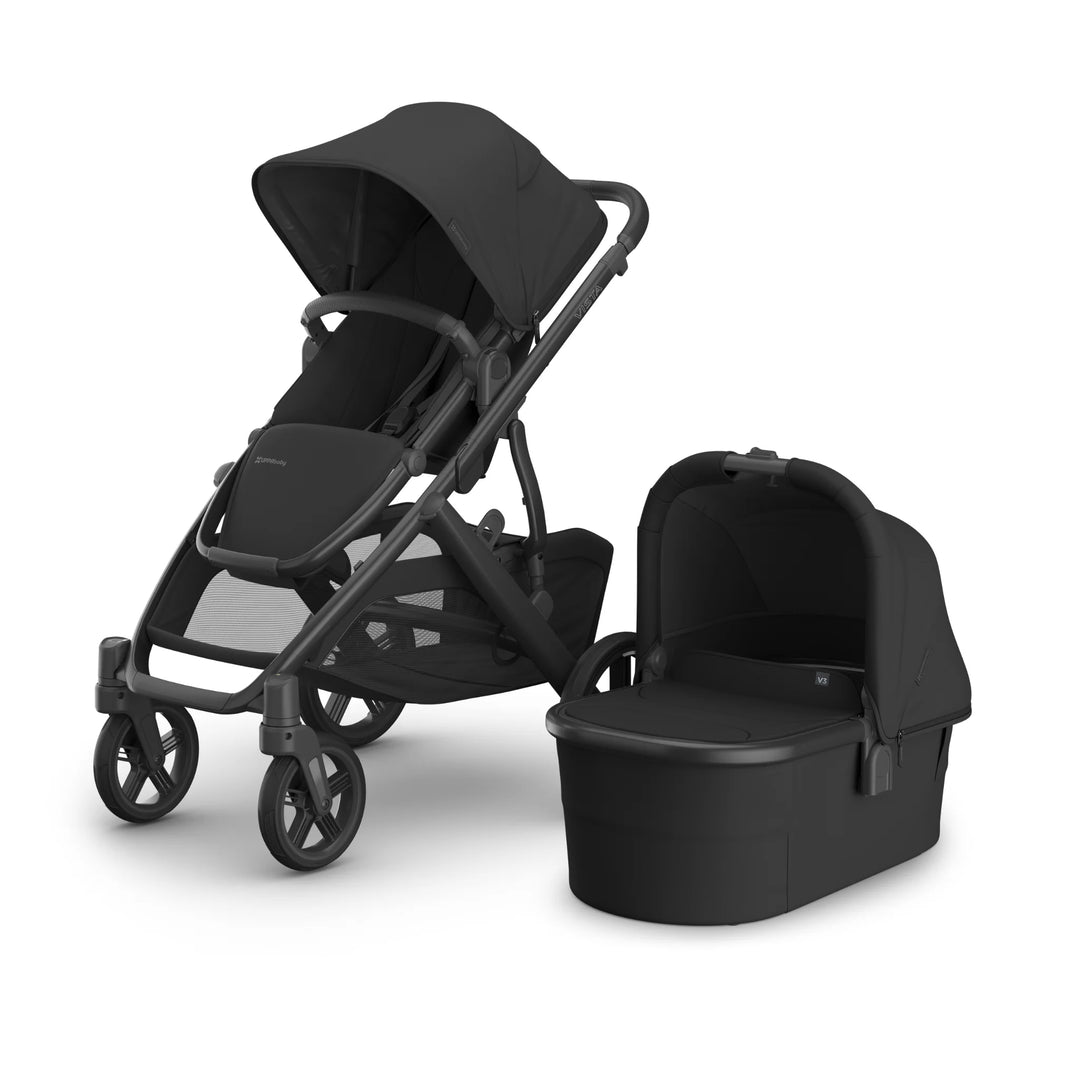 UPPAbaby Vista V3 Jake stroller and matching black bassinet set shown on a white background, featuring all-black fabric, reversible toddler seat, large storage basket, and newborn-ready bassinet.