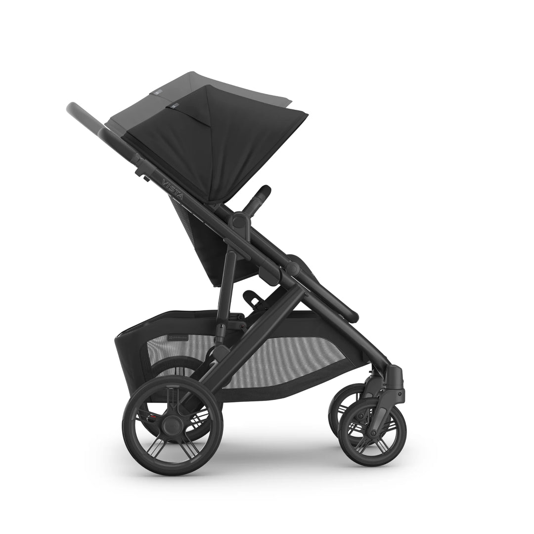 UPPAbaby Vista V3 Jake stroller in black shown in side view with forward-facing toddler seat fully reclined, large extendable sun canopy, durable all-terrain wheels, and oversized storage basket.