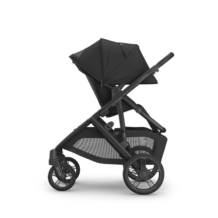 UPPAbaby Vista V3 Jake stroller in black shown in side profile with toddler seat fully reclined, extendable sun canopy, all-terrain wheels, and spacious under-seat storage basket.
