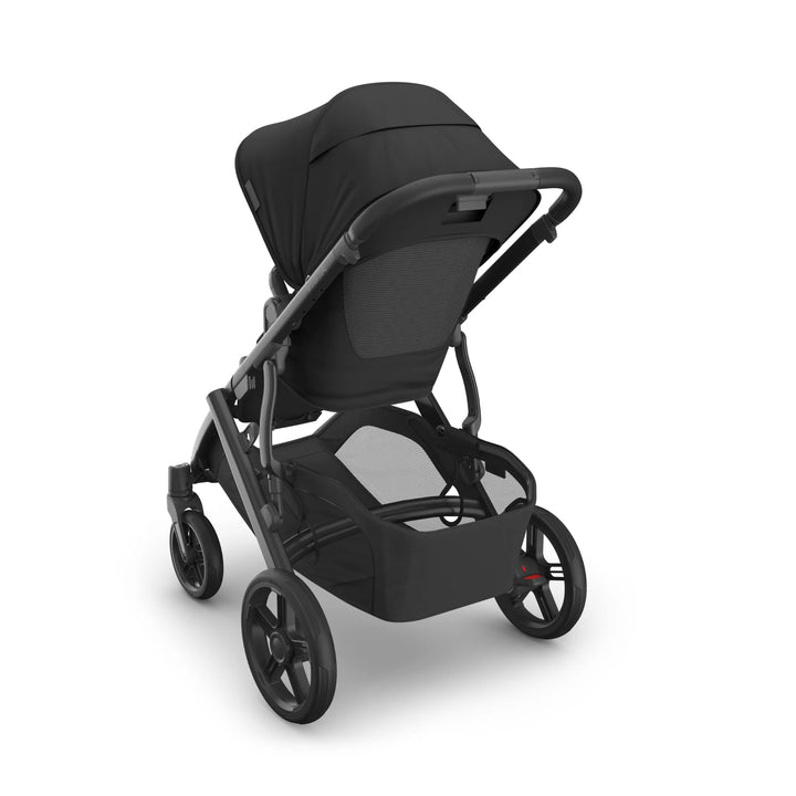 UPPAbaby Vista V3 Jake stroller rear view in black, showing reversible toddler seat, ventilated back panel, adjustable handlebar, large storage basket, and all-terrain wheels.
