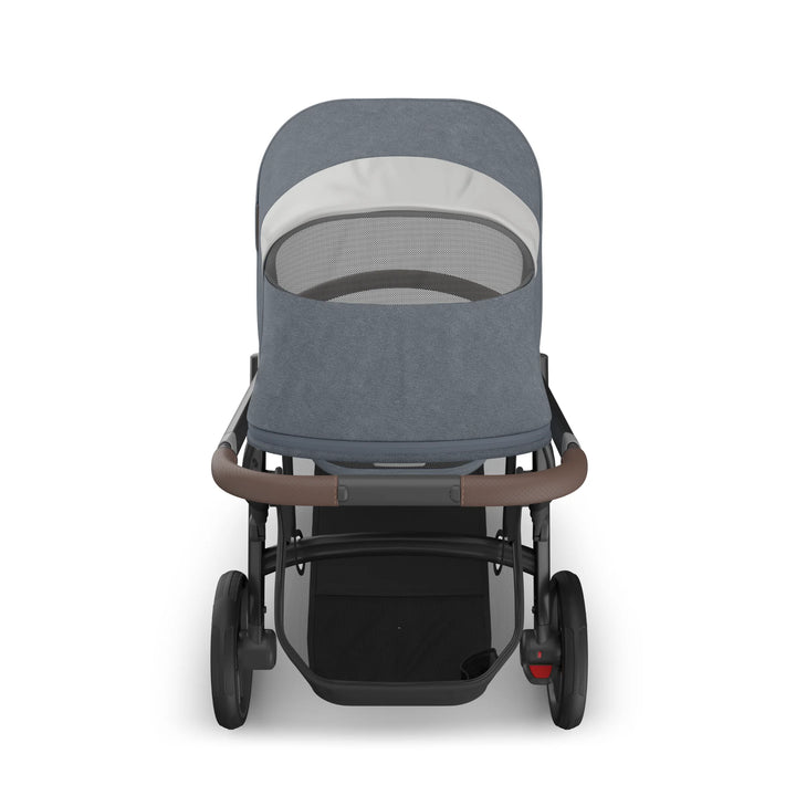Rear view of the UPPAbaby Vista V3 stroller in Jullian blue, showing the toddler seat with extended ventilated canopy, leather push handle, large storage basket and sturdy all-terrain wheels on the premium Vista travel system