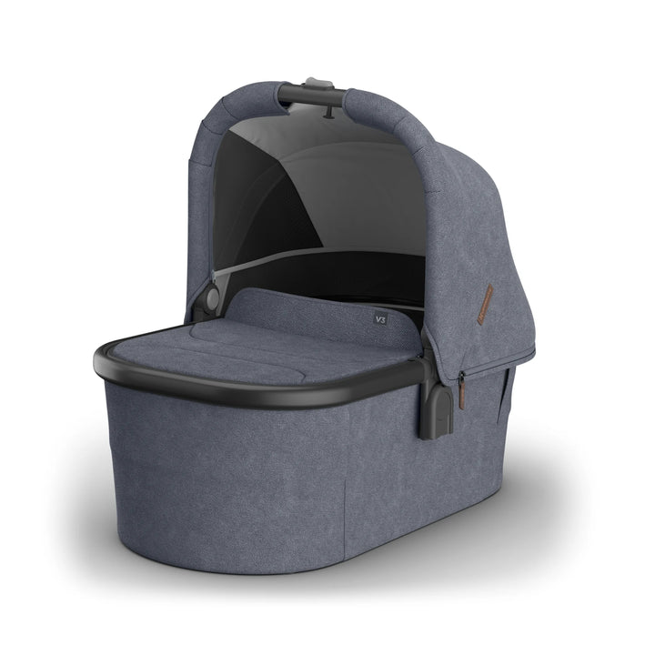 UPPAbaby Vista V3 bassinet in Jullian blue fabric shown in a studio product shot, featuring extended sun canopy, breathable mesh ventilation panel and sleek modern design for newborn comfort and premium stroller travel systems.