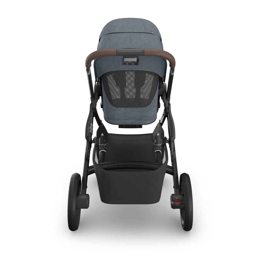 Rear view of the UPPAbaby Vista V3 stroller in Jullian blue, showing the toddler seat with ventilated back panel, leather-accented handlebar, large rear wheels and spacious under-seat storage basket on the premium Vista travel system.