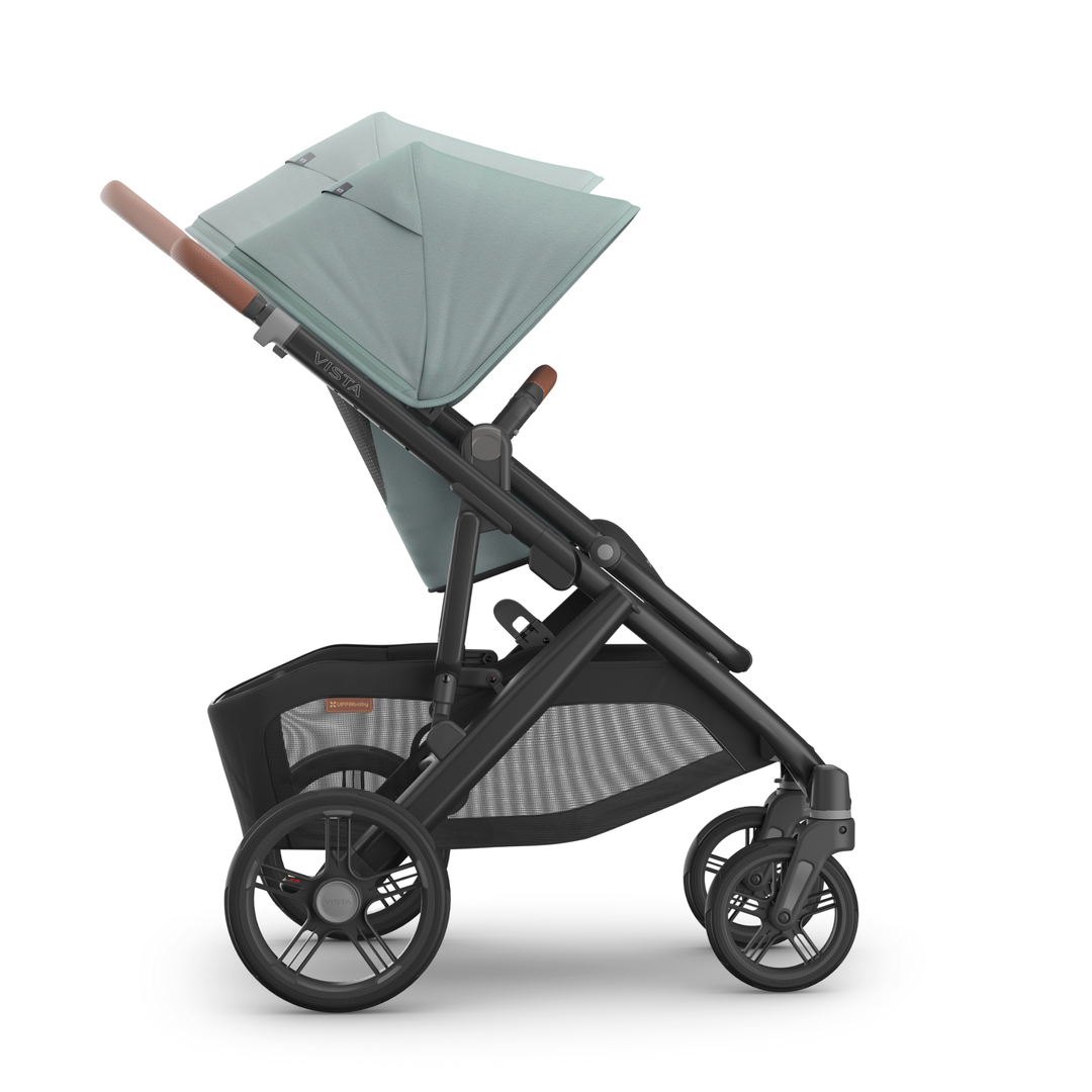 This image shows the Vista V3 in Kenzi and the handlebar and canopy extension features.