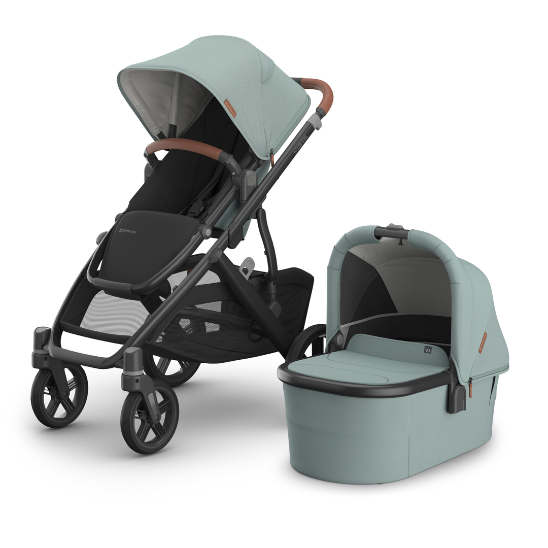 This image shows the Vista V3 in Kenzi with the Carrycot V3 alongside it.