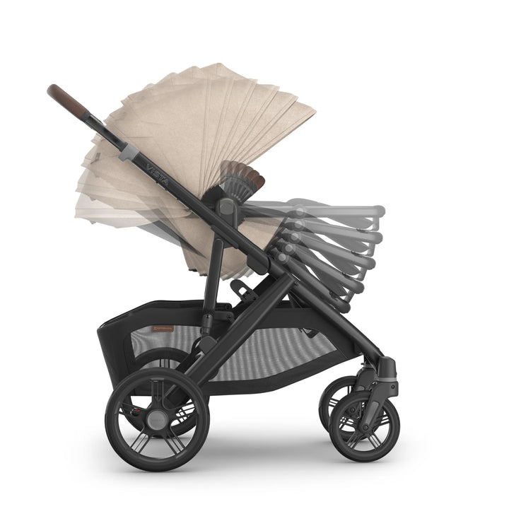 Side view of the UPPAbaby Vista V3 stroller in the Liam oatmeal colourway demonstrating multiple toddler-seat recline positions, extendable canopy range, adjustable seating angles and the stroller’s durable all-terrain frame and storage basket.