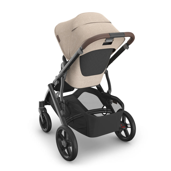 Rear view of the UPPAbaby Vista V3 stroller in the Liam oatmeal colourway with the toddler seat reversed and insert installed, featuring a breathable mesh back panel, premium leather-accented handlebar, spacious under-seat storage basket and durable all-terrain wheels.