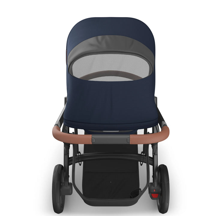 Rear view of the UPPAbaby Vista V3 stroller in the Noa navy blue colourway showing the peekaboo mesh ventilation window, premium leather-accented handlebar, sturdy all-terrain wheels and extra-large under-seat storage basket.