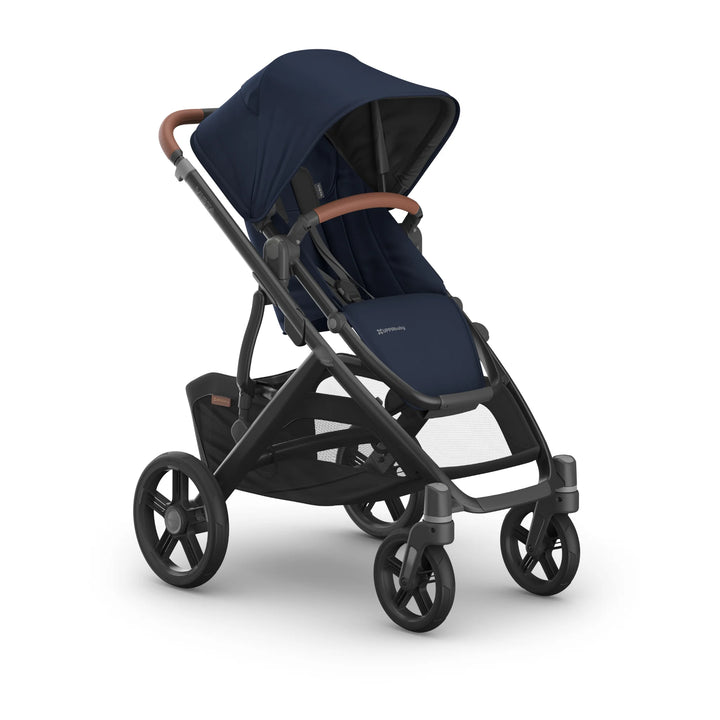 UPPAbaby Vista V3 stroller in the Noa navy blue colourway angled from the front-left, showcasing the extendable canopy, premium leather-accented bumper bar, ergonomic toddler seat, all-terrain wheels and large under-seat storage basket.