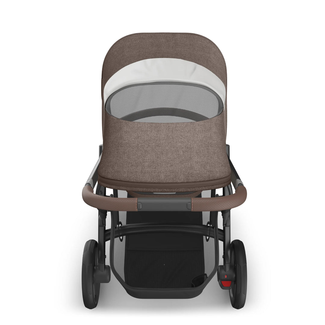 Rear view of the UPPAbaby Vista V3 stroller in Owen, showing the brown textured toddler seat canopy with ventilated mesh panel, leather-accented push handle, large all-terrain wheels and spacious under-seat storage basket on the premium Vista travel system.