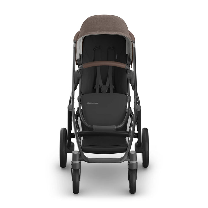 Front-facing view of the UPPAbaby Vista V3 stroller in Owen, showcasing the brown textured canopy, leather bumper bar, padded toddler seat, robust all-terrain wheels and premium Vista travel system design.