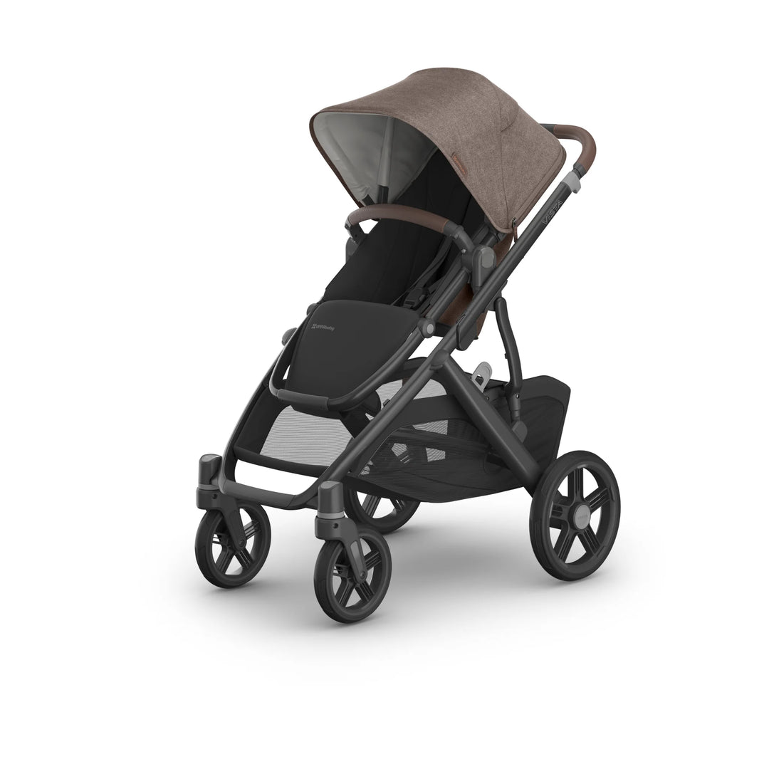 UPPAbaby Vista V3 Owen stroller in forward-facing mode featuring a brown canopy, leather-trimmed handlebar, black toddler seat, large all-terrain wheels, and spacious under-seat storage basket on a white background