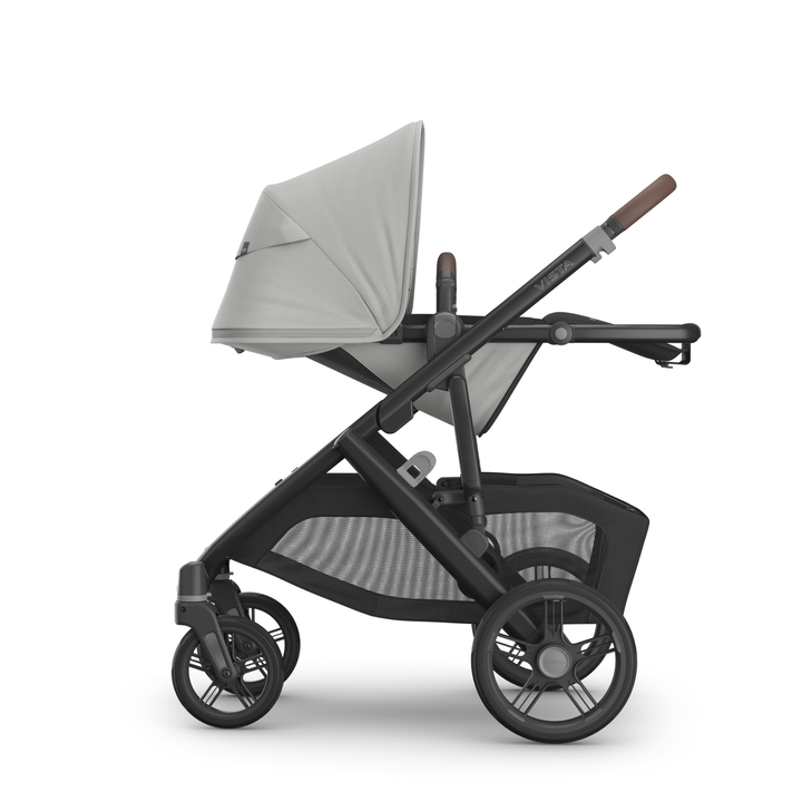 This image shows the Vista V3 in Savannah with the toddler seat in the lie flat recline position.