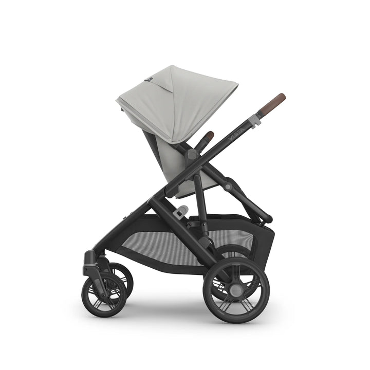 UPPAbaby Vista V3 Savannah stroller side view featuring light grey toddler seat, extendable canopy, adjustable recline, large all-terrain wheels, and spacious storage basket on premium charcoal frame.
