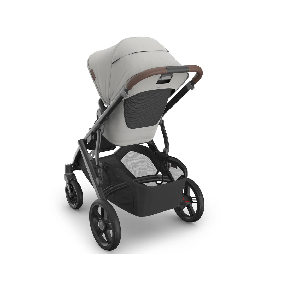 UPPAbaby Vista V3 Savannah stroller rear view featuring light grey toddler seat, ventilated back panel, leather-accented handlebar, large storage basket, and durable all-terrain wheels on matte black frame.