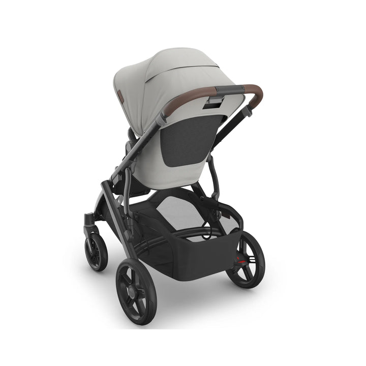UPPAbaby Vista V3 Savannah stroller rear view featuring light grey toddler seat, ventilated back panel, leather-accented handlebar, large storage basket, and durable all-terrain wheels on matte black frame.