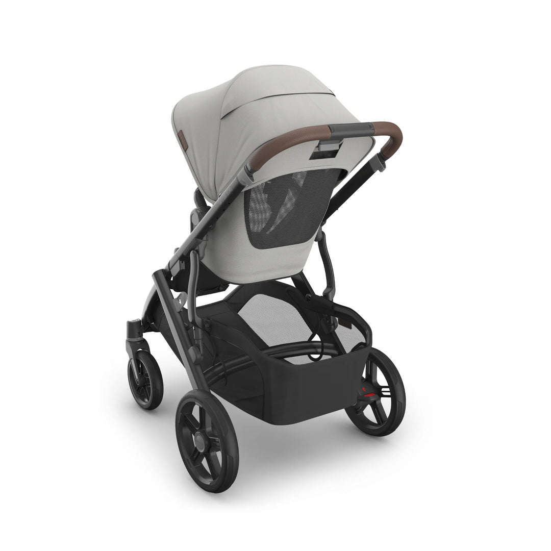 UPPAbaby Vista V3 Savannah stroller rear view showcasing light grey toddler seat, breathable mesh back panel, leather-accented handlebar, spacious under-seat storage basket, and durable all-terrain wheels on a matte black frame.