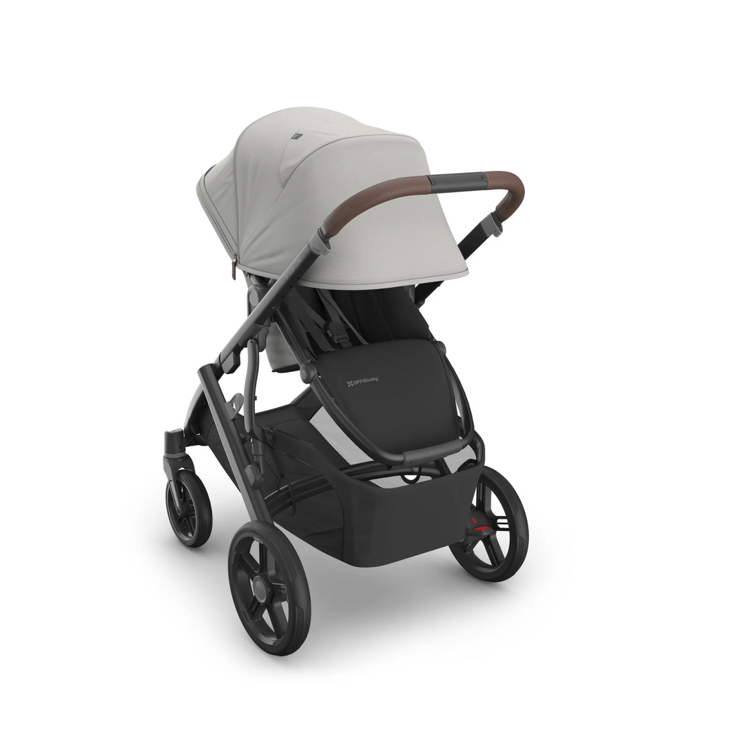 UPPAbaby Vista V3 Savannah stroller in light grey with toddler seat, extended canopy, leather-accented handlebar, large storage basket, and all-terrain wheels on a matte black frame.