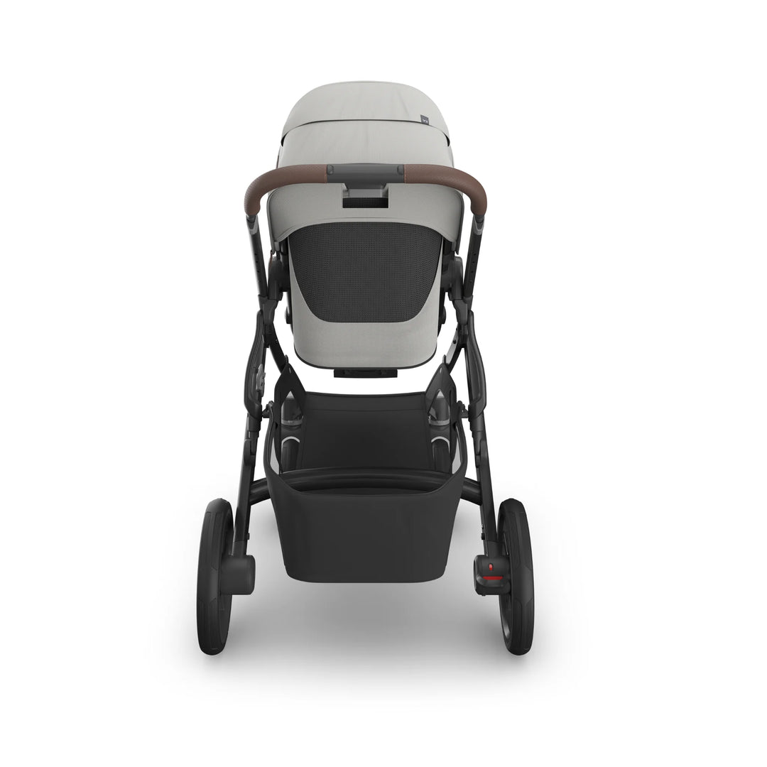 Rear view of UPPAbaby Vista V3 Savannah stroller in light grey, featuring ventilated toddler seat, leather-accented handlebar, large under-seat storage basket, and durable all-terrain wheels.