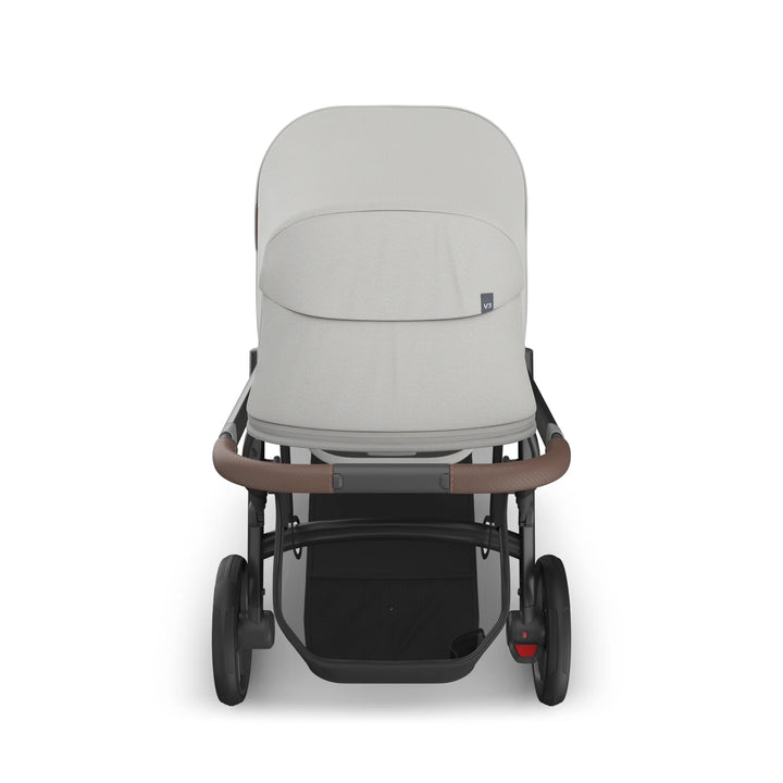 Front-facing view of UPPAbaby Vista V3 Savannah bassinet stroller in light grey with full canopy, leather handlebar, large storage basket, and all-terrain wheels on white background.