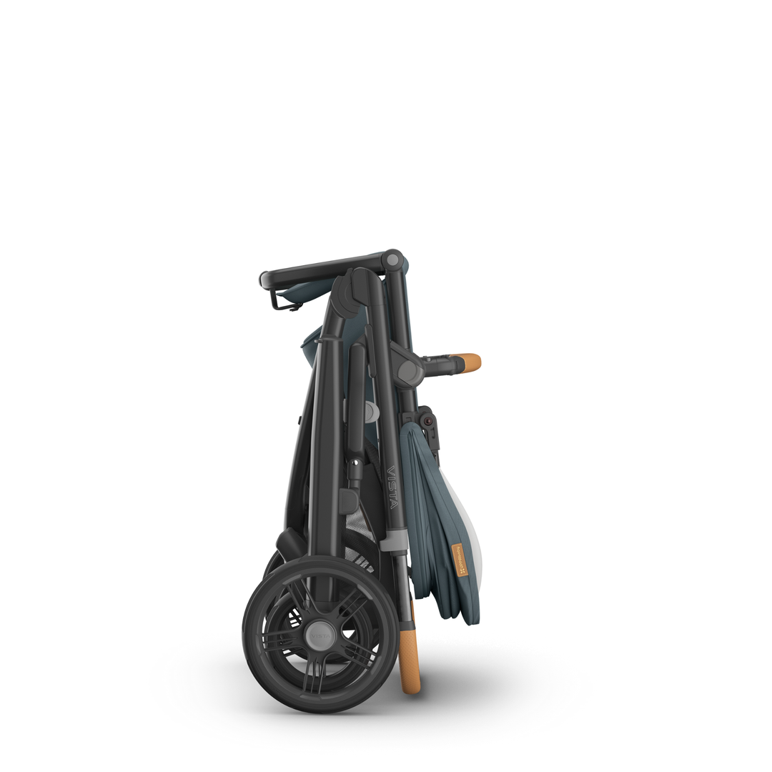 This image shows the UPPAbaby Vista V3 stroller in Dillan folded with the toddler seat unit on.