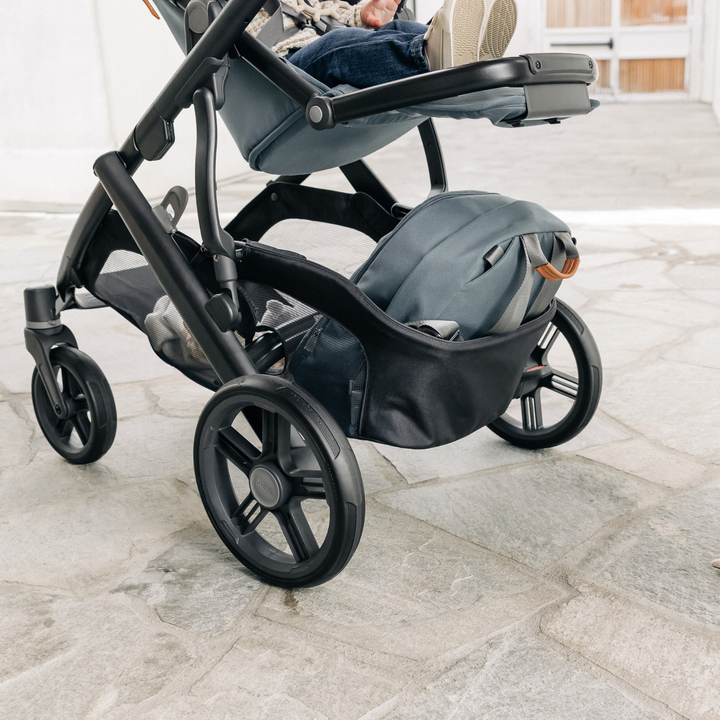 This is a lifestyle image of the Vista V3 stroller, showcasing the large basket feature.