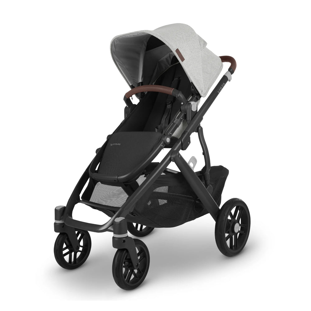 UPPAbaby Vista V2 Anthony pushchair in light grey fabric with brown leather handle and black frame, featuring large all-terrain wheels and spacious storage basket — stylish, durable stroller designed for comfort and performance