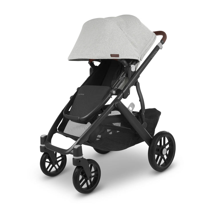 UPPAbaby Vista V2 Anthony pushchair in light grey fabric with brown leather handle and black frame, featuring extendable canopy, all-wheel suspension, and large underseat storage — stylish, practical baby stroller for everyday use.