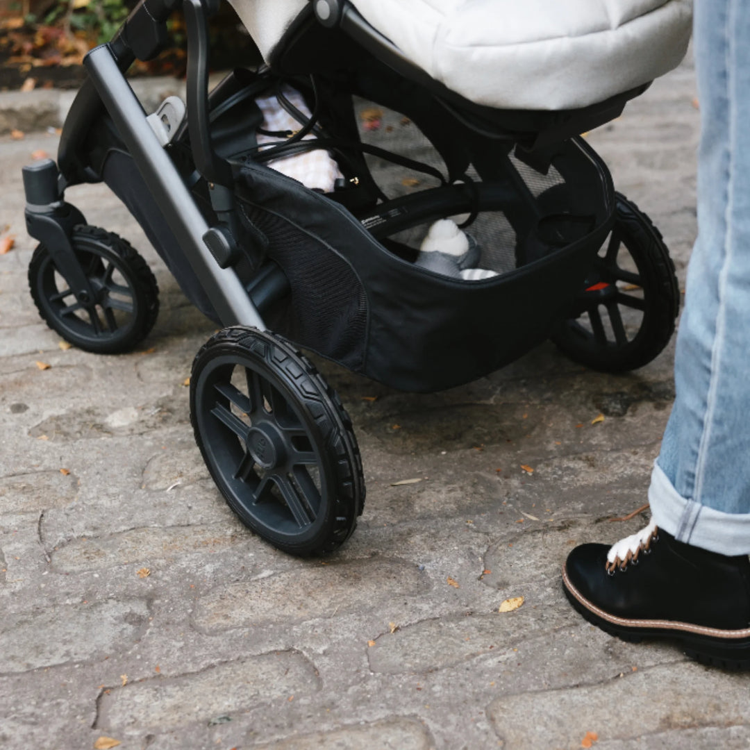 “Close-up of UPPAbaby Vista V2 all-terrain wheels fitted to stroller, improved grip for outdoor walks”