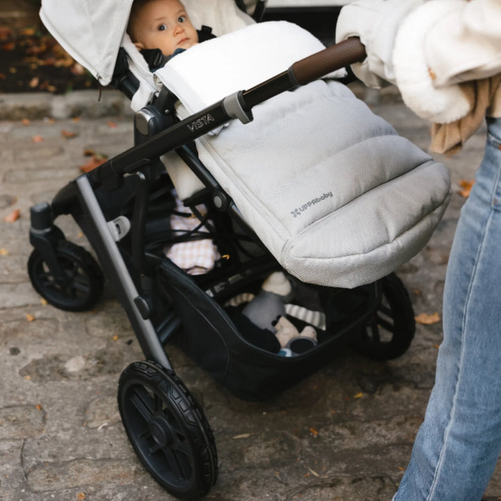 “UPPAbaby Vista V2 stroller with all-terrain wheels in use, smooth ride for baby on outdoor paths”
