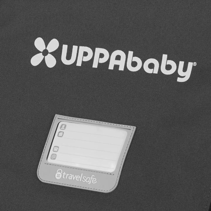 Close-up of the UPPAbaby Minu V2 stroller travel bag showing the logo and TravelSafe ID tag window.