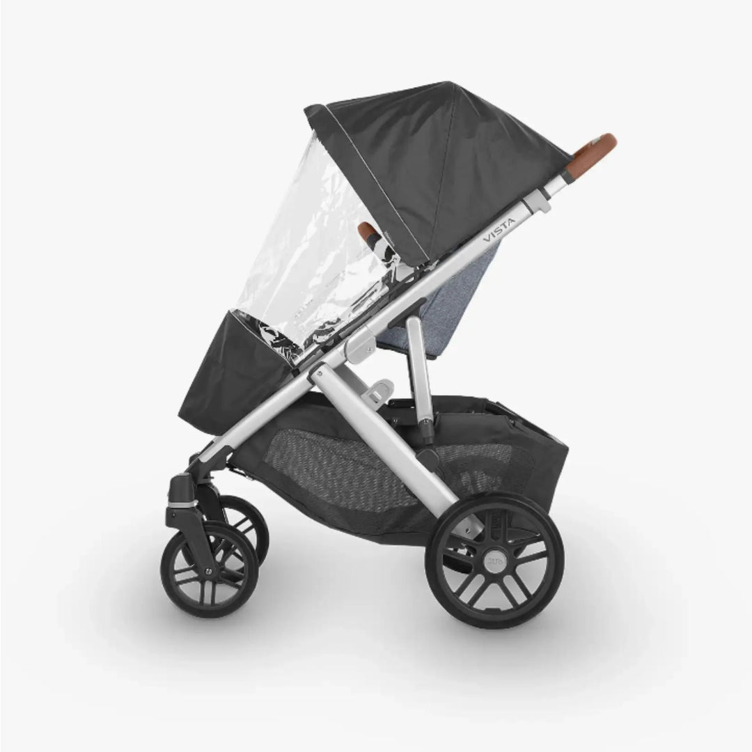 UPPAbaby Performance Rain Shield fitted on UPPAbaby Vista V3 stroller (side view), clear weather cover protecting baby from rain and wind.