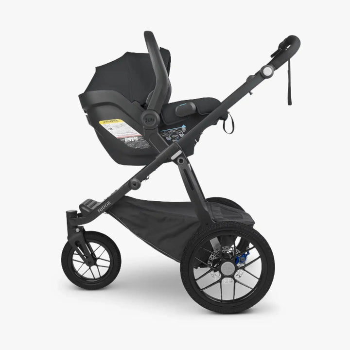 UPPAbaby RIDGE all-terrain stroller with UPPAbaby MESA car seat fitted via adapter set.”