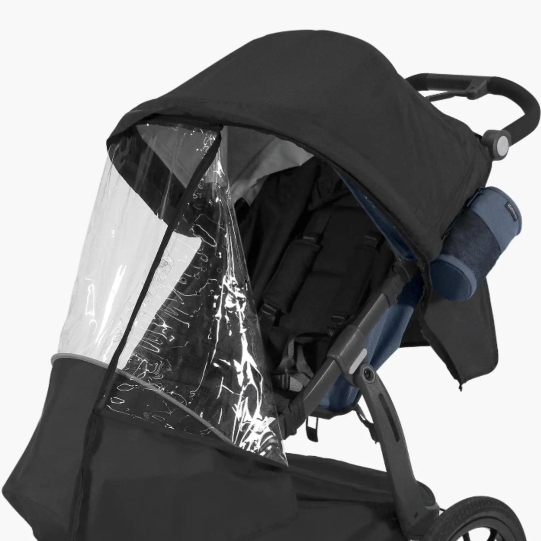 UPPAbaby RIDGE stroller with Performance Rain Shield fitted, clear waterproof cover and canopy providing full weather protection for baby while jogging or walking.