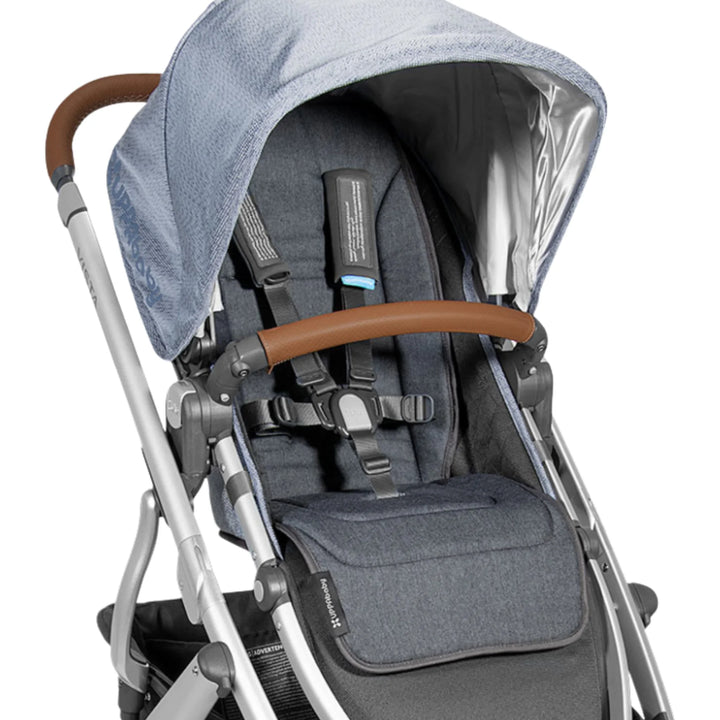 UPPAbaby reversible stroller seat liner in Reed fitted on a stroller seat, shown in dark grey.