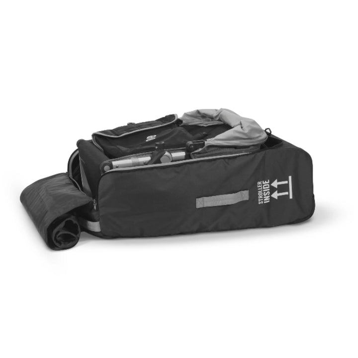 “UPPAbaby VISTA and CRUZ stroller travel bag open with stroller packed inside on a white background.”
