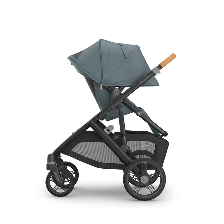 Side profile of the UPPAbaby Vista V3 stroller in the Dillian colourway, featuring a fully extended canopy, ergonomic leather handle, spacious toddler seat and large all-terrain wheels. Premium modular pushchair design with oversized storage basket, shown on a clean white background.