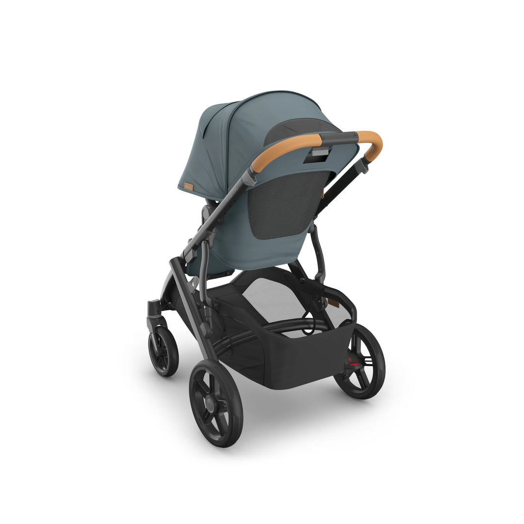Rear angled view of the UPPAbaby Vista V3 stroller in the Dillian colourway, featuring an extendable canopy with breathable mesh panel, ergonomic leather handlebar, large puncture-resistant wheels and an oversized under-seat storage basket. Premium modular pushchair design displayed on a clean white background.