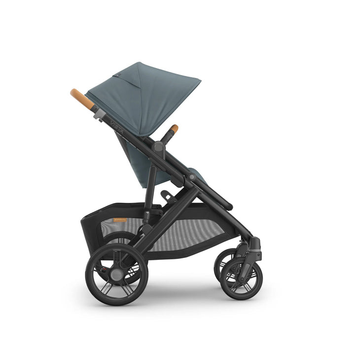 Side view of the UPPAbaby Vista V3 stroller in the Dillian colourway, featuring a fully extended sun canopy, ergonomic leather handlebar, spacious toddler seat and large all-terrain wheels. Premium modular pushchair with oversized under-seat storage basket, shown on a clean white background.