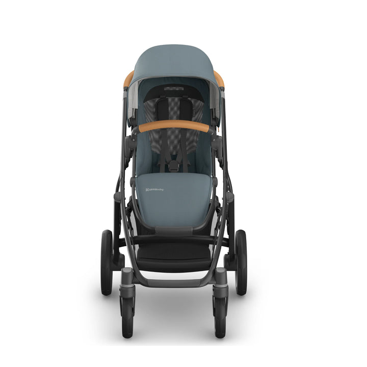 Front view of a modern UPPAbaby Vista V3 stroller in teal blue with leather accents, shown upright on a white background. Premium pushchair design featuring durable wheels, adjustable canopy, padded seat and secure harness, ideal for parents seeking a high-quality baby stroller.