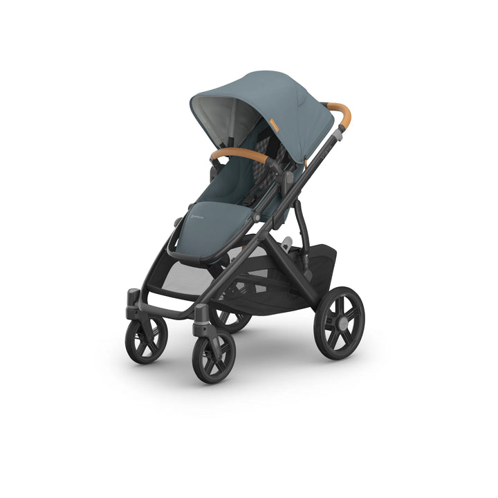 Angled front-side view of the UPPAbaby Vista V3 stroller in the Dillian colourway, featuring a extendable sun canopy, ergonomic leather handlebar, padded toddler seat, and large all-terrain wheels. Premium modular pushchair design with oversized storage basket, shown on a clean white background.