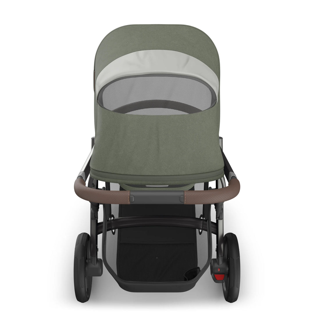 Rear view of the UPPAbaby Vista V3 carrycot in the Evelyn colourway, showing the breathable mesh ventilation panel, premium textured canopy fabric, leather-accented handlebar and large puncture-resistant wheels. Luxury newborn carrycot and pushchair system displayed on a clean white background.