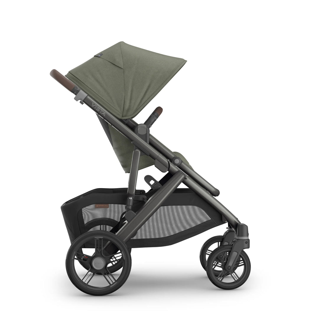 Side view of the UPPAbaby Vista V3 stroller in the Evelyn colourway, featuring the toddler seat in an upright position with UPF sun canopy extended, premium leather handlebar, durable all-terrain wheels and an oversized under-seat storage basket. Luxury modular pushchair displayed on a clean white background.
