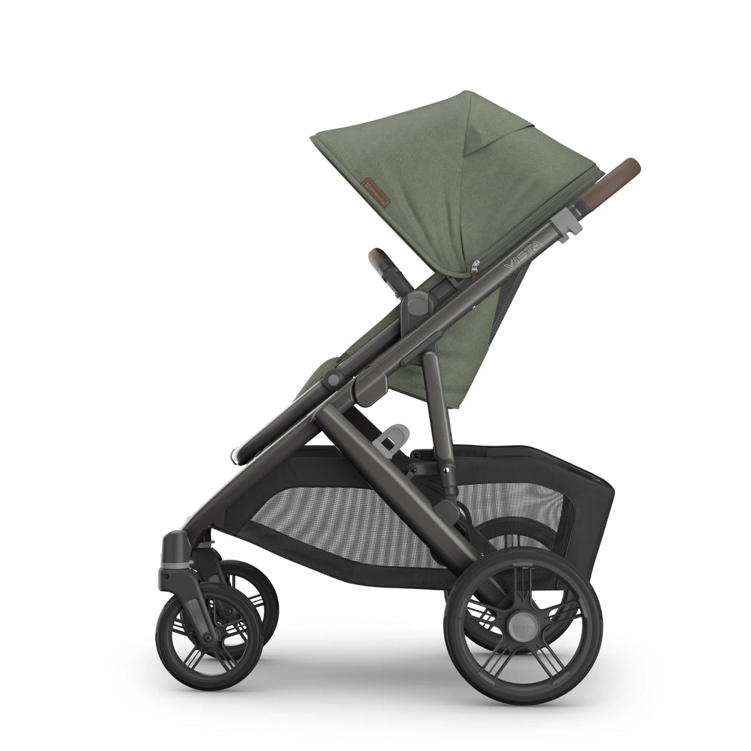 Side view of the UPPAbaby Vista V3 stroller in the Evelyn colourway, shown with the toddler seat upright and UPF sun canopy extended. Features premium leather handlebar, durable all-terrain wheels, breathable seat fabrics and an oversized under-seat storage basket, displayed on a clean white background.